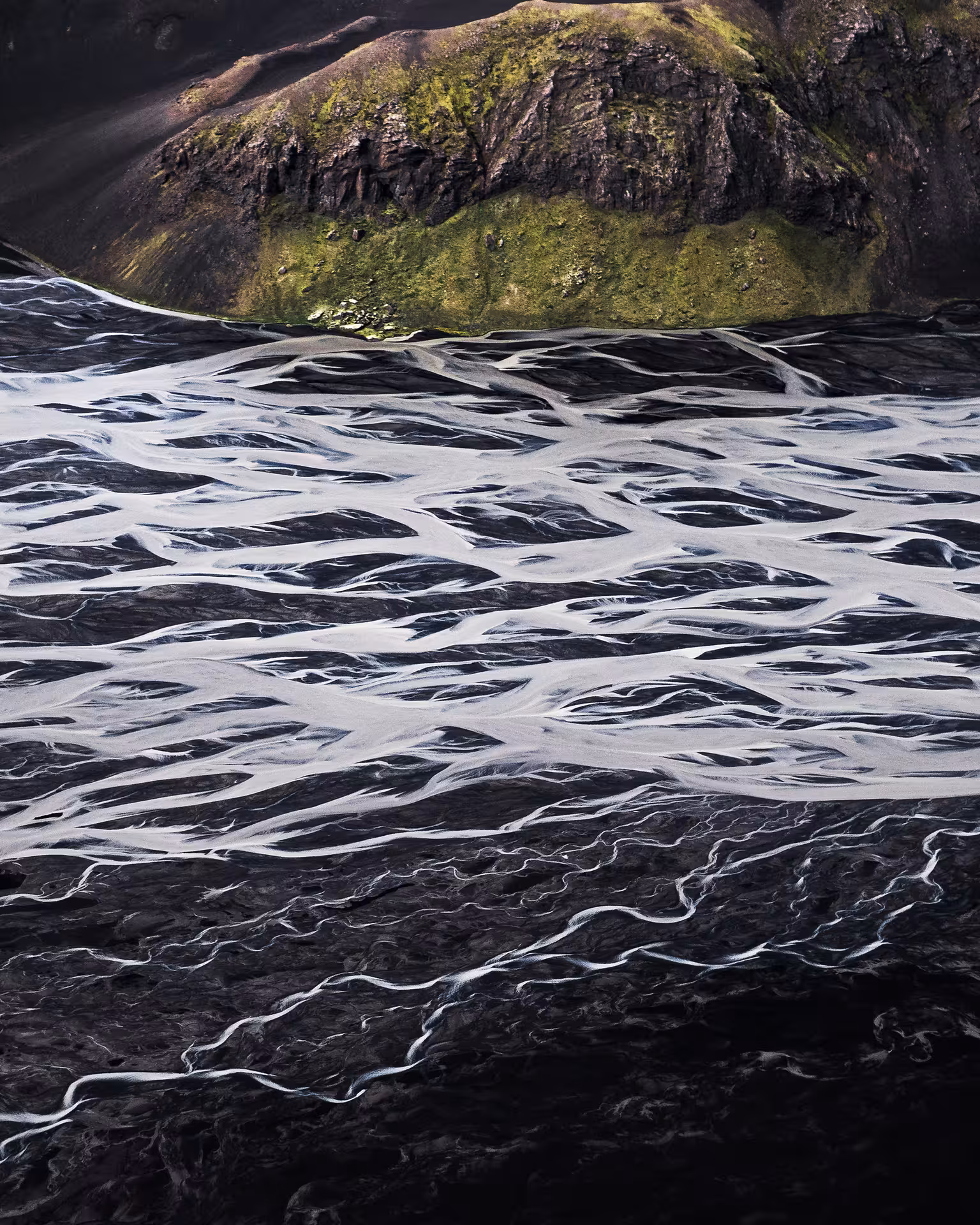 Aerial view of braided glacial rivers on black volcanic sand near Skaftafell, Iceland