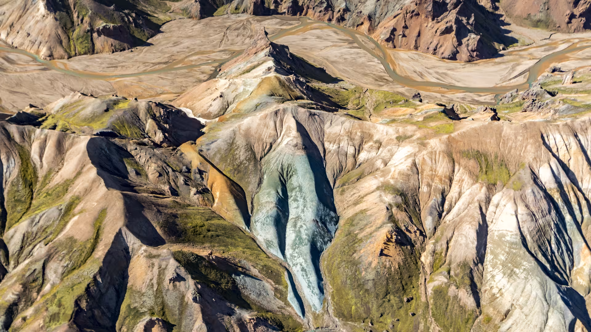 Aerial view of colorful rhyolite mountains and glacial river valleys near Skaftafell, Iceland