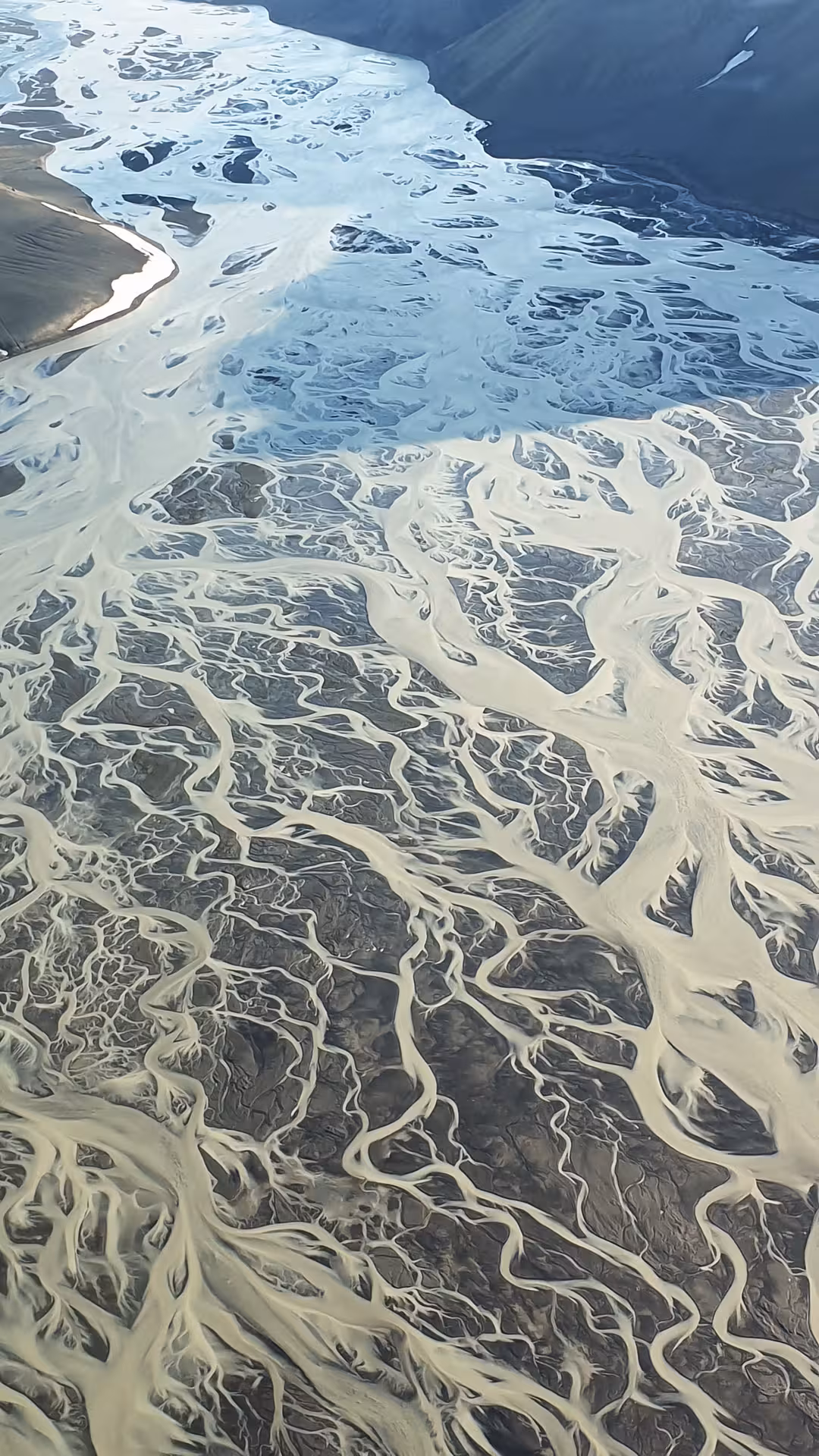 Aerial view of braided glacial river delta with sandy channels near Skaftafell, Iceland