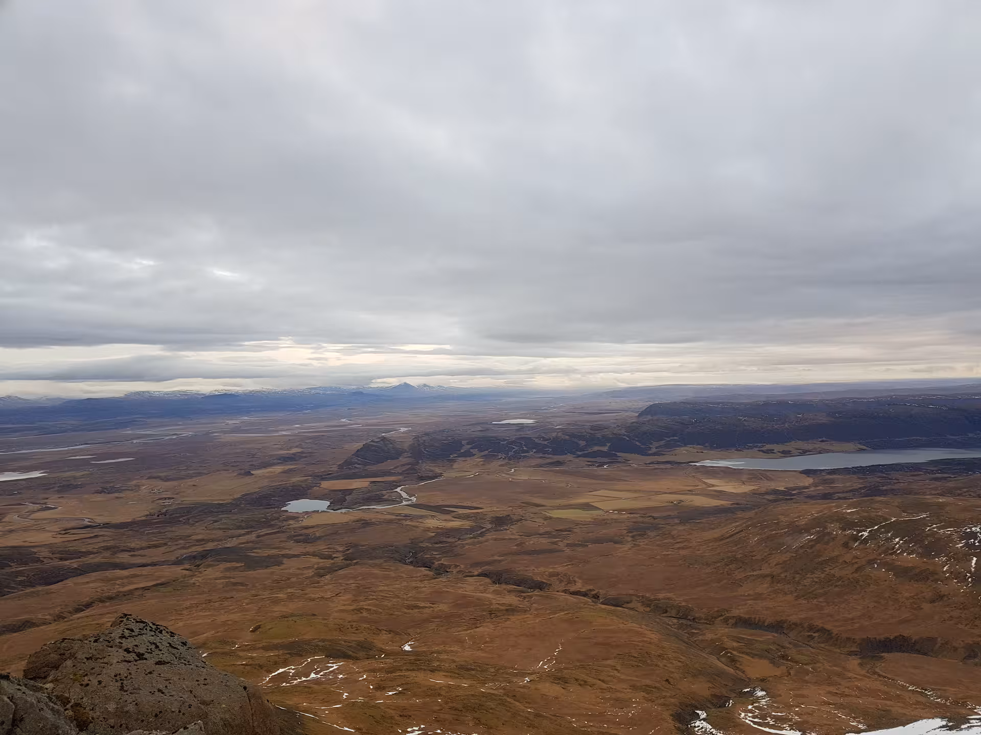 Panoramic aerial view of Icelandic highlands with lakes and river valleys from Skessuhorn mountain summit