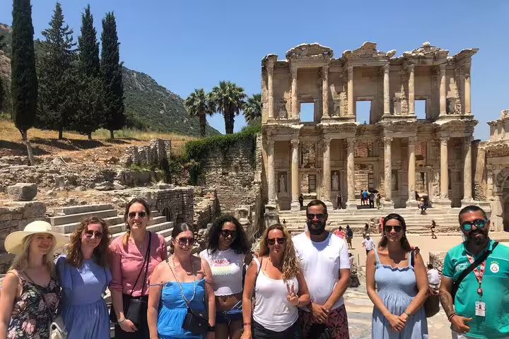 Group of tourists enjoying a skip-the-line tour at the iconic Library of Celsus in Ephesus, Turkey.