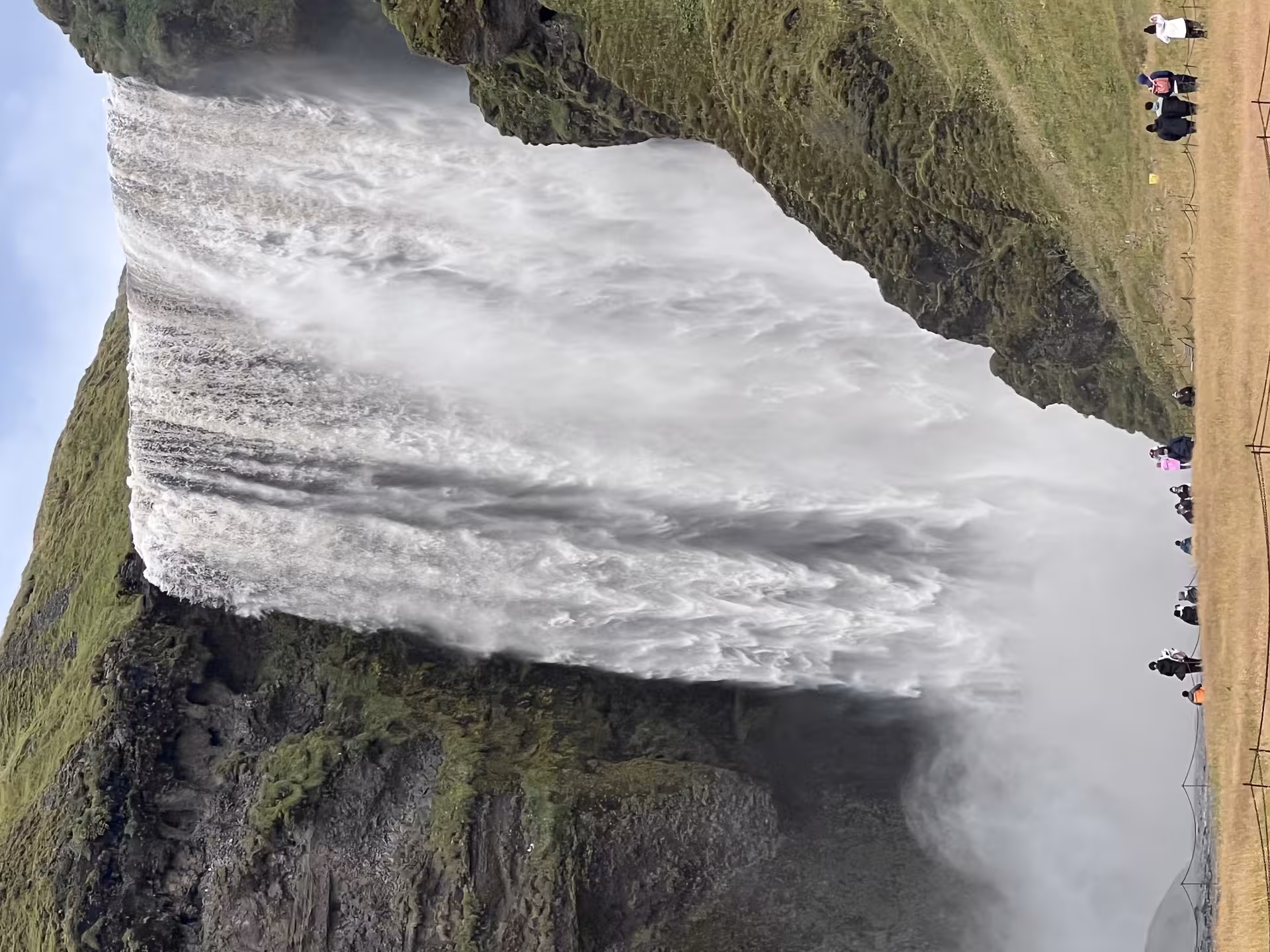 Skogafoss waterfall on Iceland South Coast private tour from Reykjavik, misty cascade and viewing path
