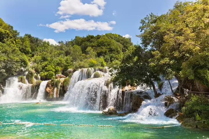 Skradinski Buk waterfall in Krka National Park, Croatia, turquoise pool and cascades on guided tour
