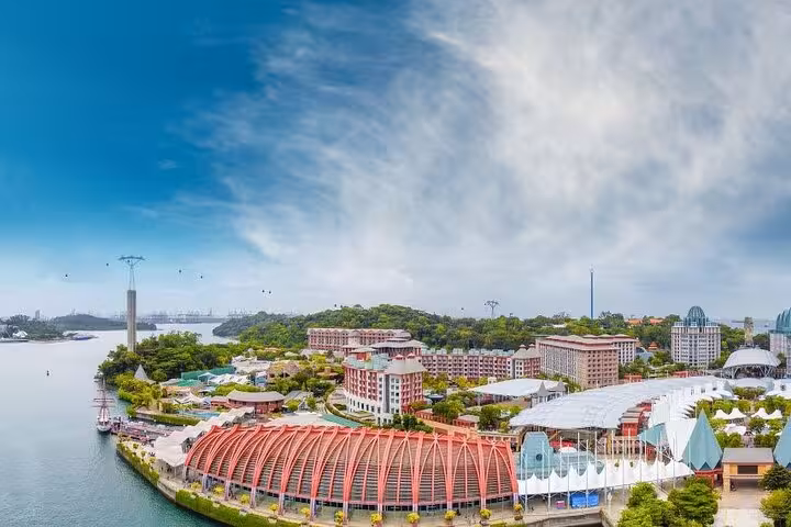 Aerial view of Sentosa Island waterfront near SkyHelix Sentosa, with Singapore Cable Car line and skyline