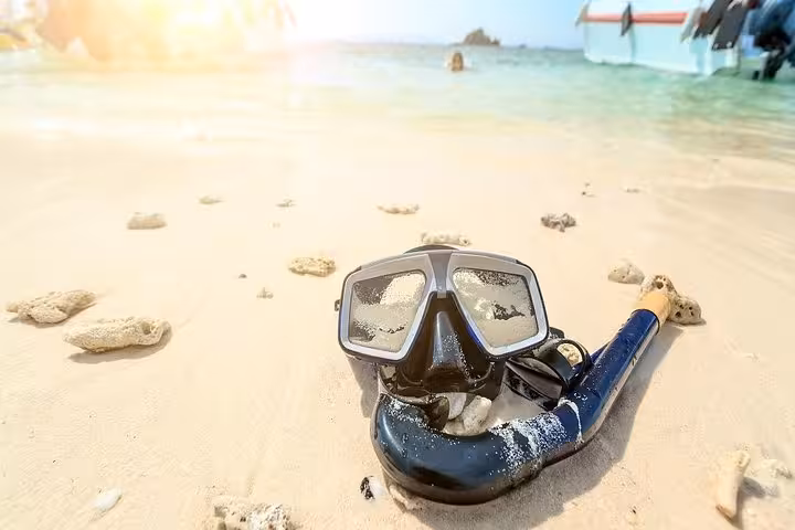 Snorkel mask on sandy beach for Red Sea private boat trip from Hurghada to Soma Bay, Safaga and El Gouna