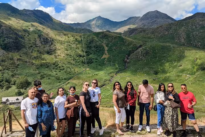 Tour group photo in Snowdonia National Park valley, a highlight of the Snowdonia & 3 Castles Tour