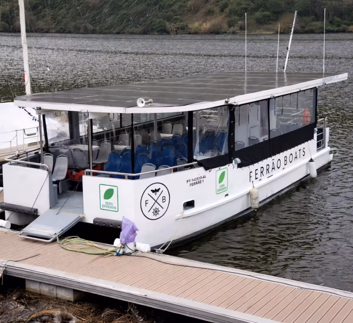 Ferrão Boats zero-emission solar-powered vessel docked on the Douro River for an eco-friendly port wine quinta tour