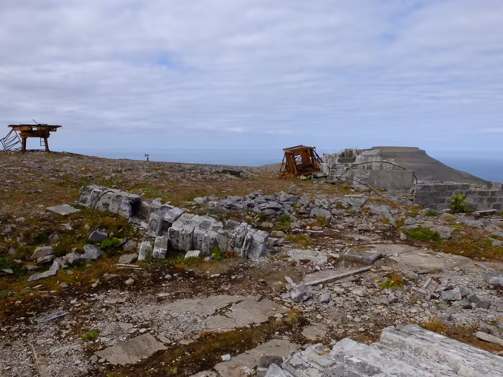Rugged coastal ruins and rocky trail viewpoint on Solar Eclipse Hike, ideal for stargazing and photography