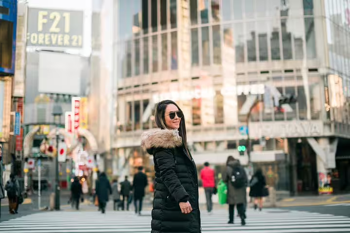 Solo traveler portrait at Shibuya Crossing, Tokyo with personal vacation photographer and city backdrop