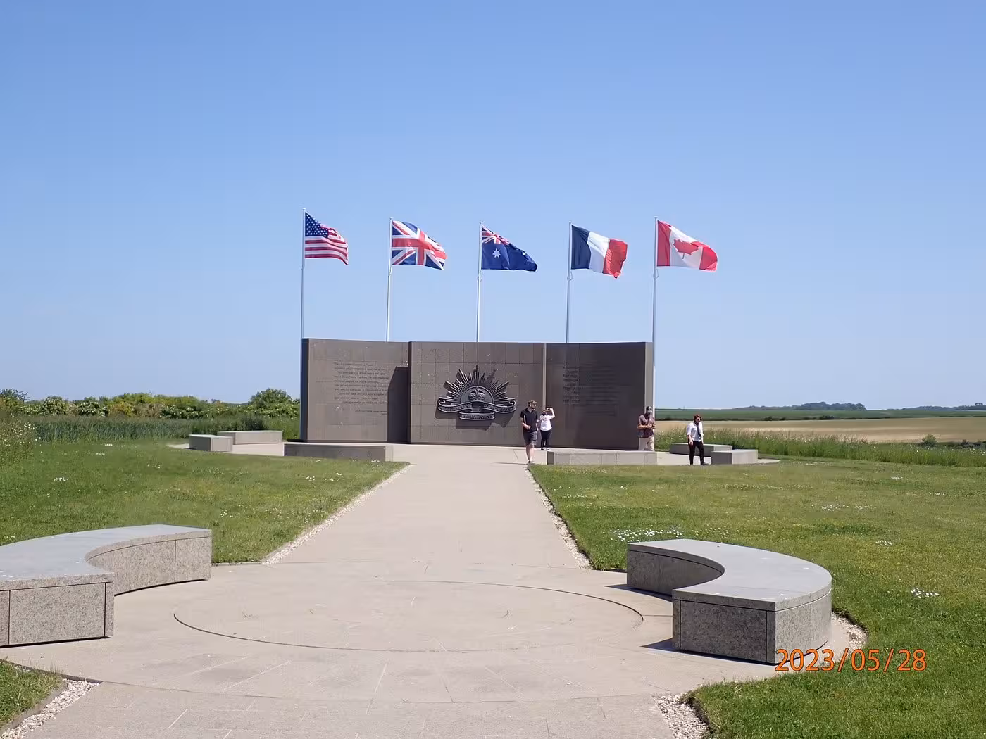 Australian WWI memorial wall with five allied flags at Somme Battlefields, France
