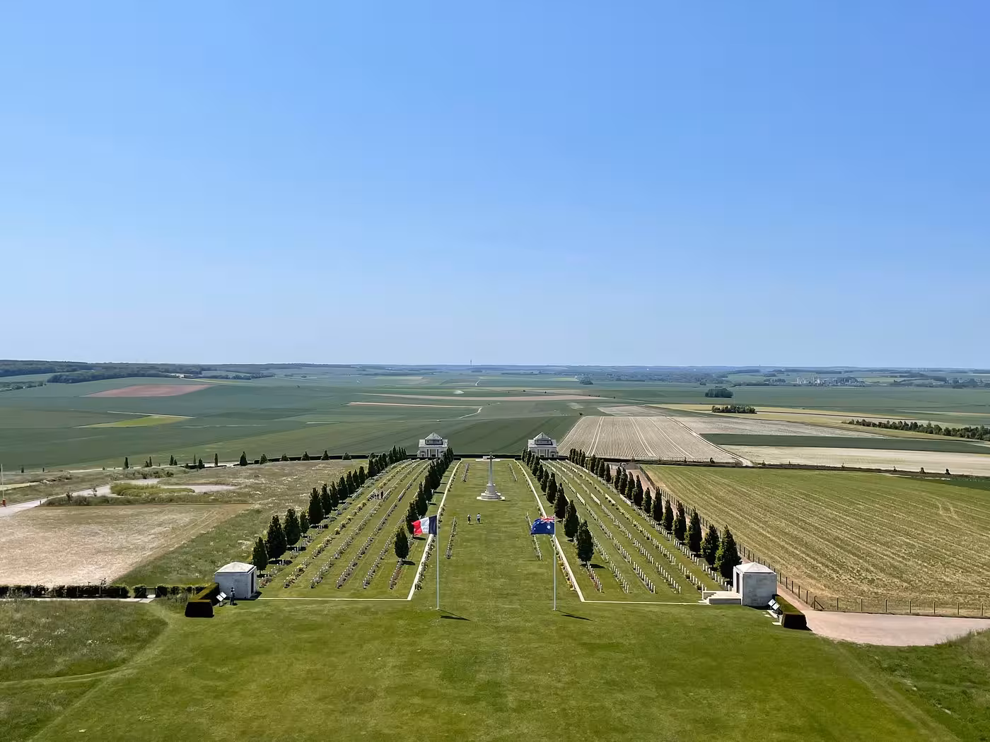 Aerial view of Villers-Bretonneux Military Cemetery with French and Australian flags, Somme battlefields France