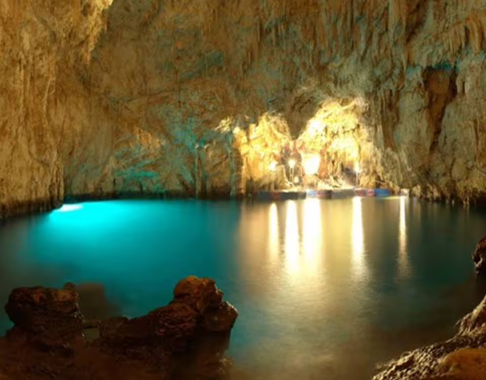 Hidden sea cave near Sorrento with turquoise water and golden rock walls illuminated on an Amalfi Coast boat excursion