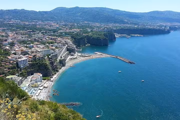 Breathtaking coastal view of Sorrento, showcasing the vibrant town and azure waters during an 8-hour day tour.