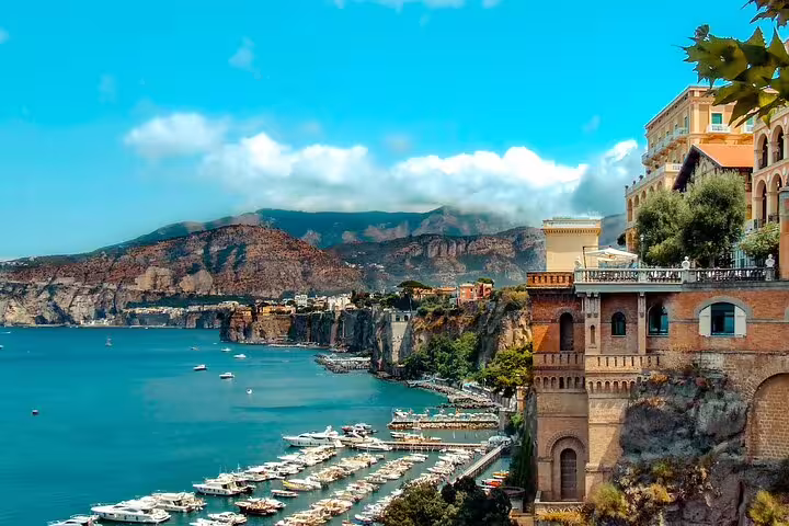 Sorrento coastline view with marina yachts and cliffside terraces on Amalfi Coast VIP small group tour