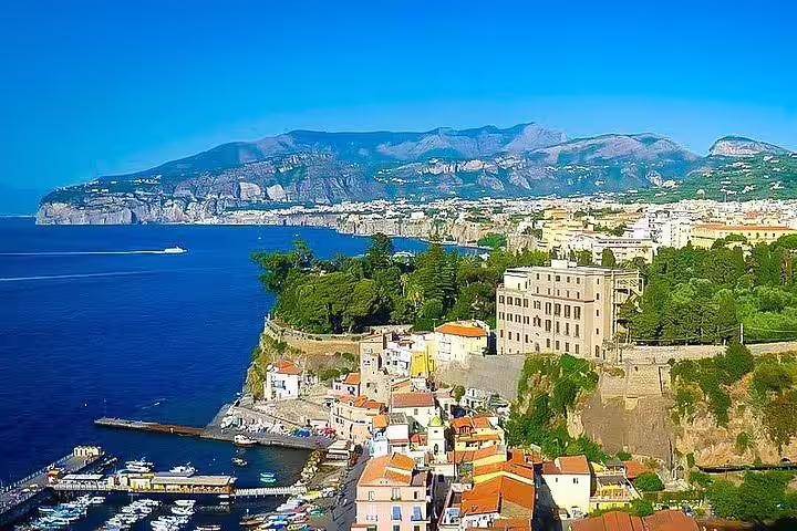 Aerial view of Sorrento’s marina, cliffs and Bay of Naples seen on a private Positano and Pompei day tour with lunch included