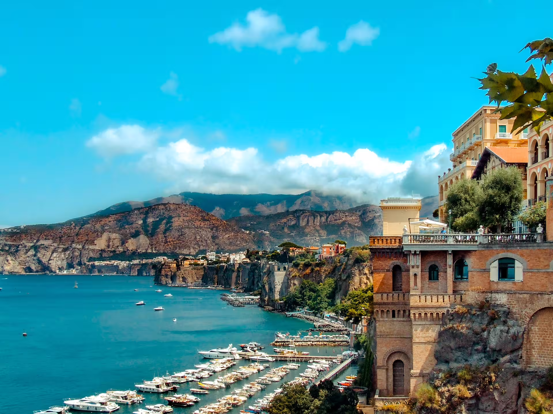 Sorrento cliffside marina and turquoise Bay of Naples view on Sorrento Positano Amalfi Coast group tour