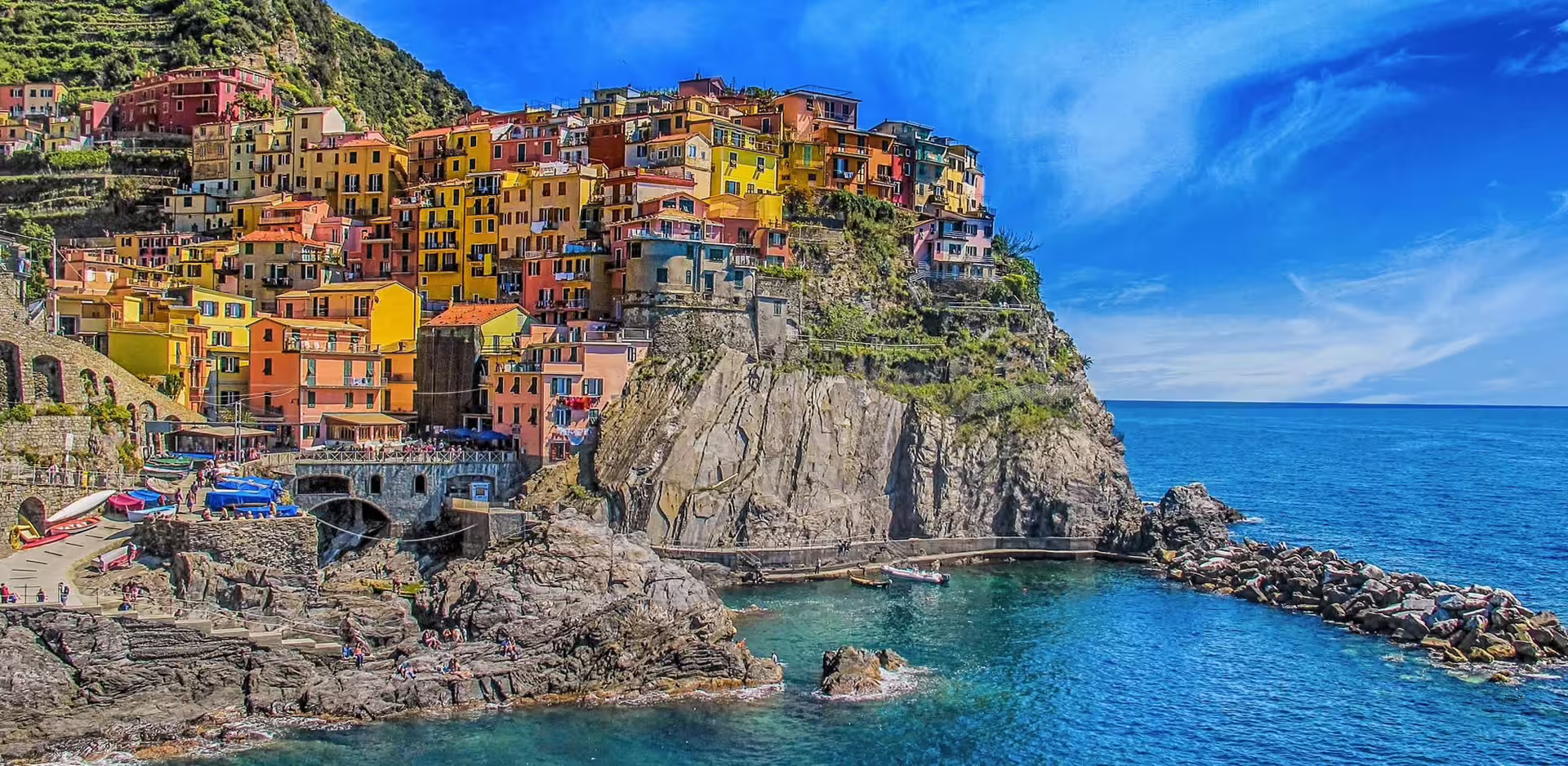 Manarola cliffside village view, colorful houses by the sea, scenic stop on Sorrento Positano Amalfi tour