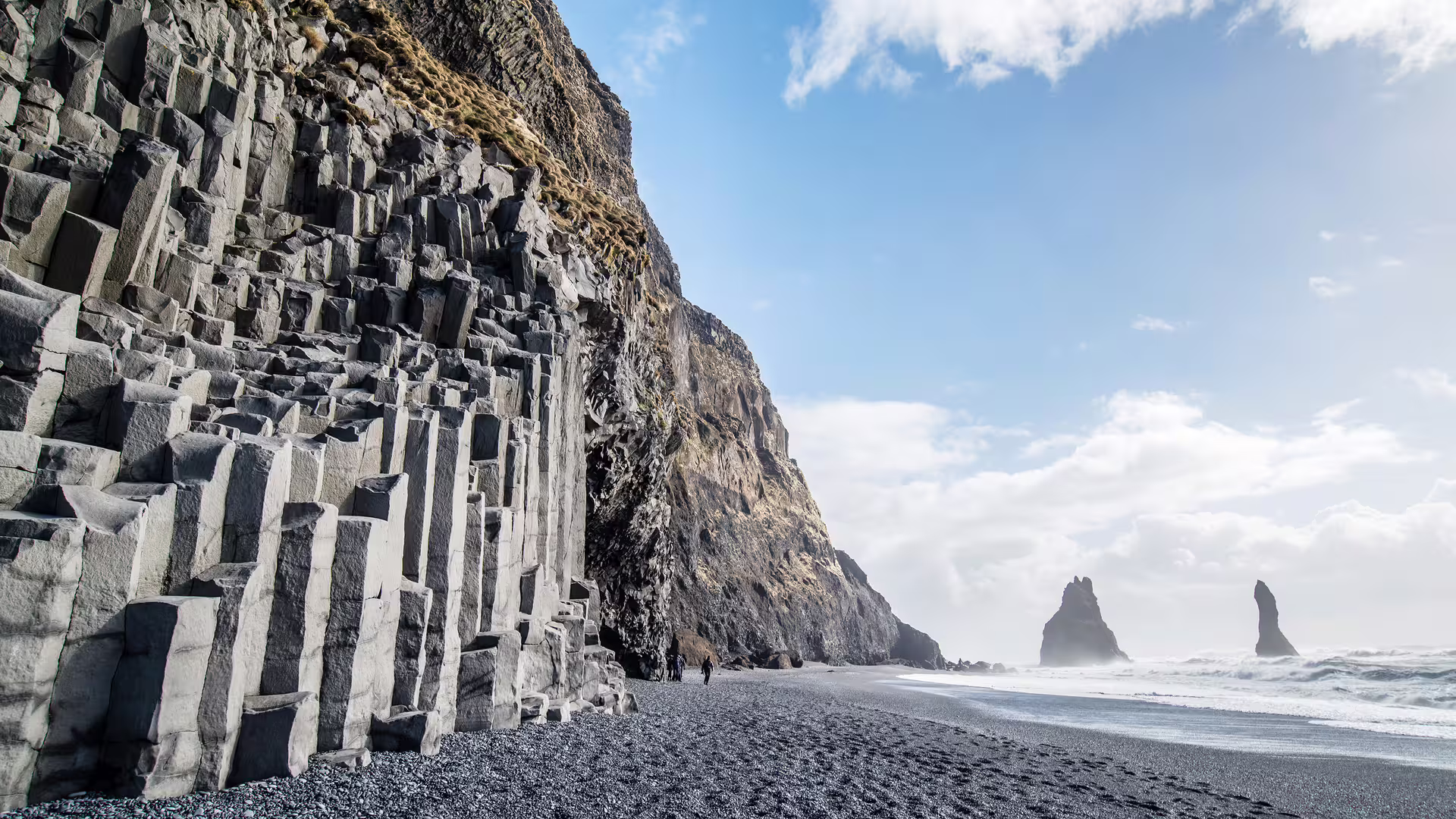 Black sand beach with basalt columns and sea stacks on Iceland's south coast