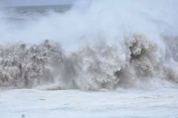 Massive stormy waves crashing on the black sand beach of Iceland's south coast