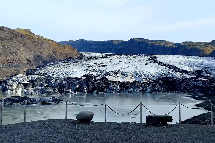 Solheimajokull glacier and glacial lagoon with rope barrier in South Iceland