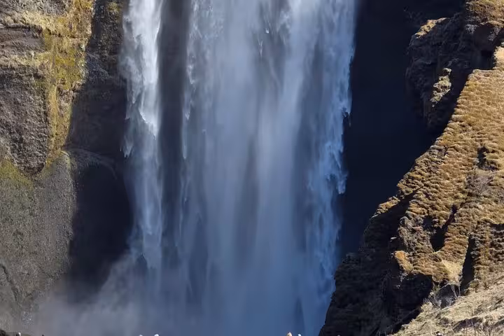 Powerful waterfall cascading down rocky cliffs on Iceland's South Coast near Reykjavik
