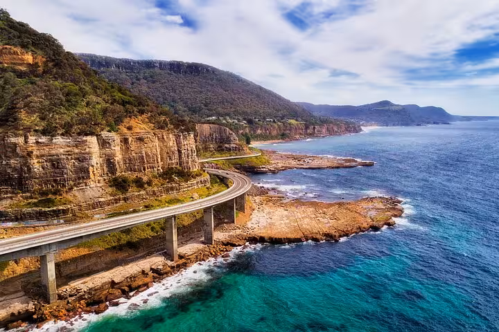 Scenic coastal drive along the Sea Cliff Bridge with ocean views on the South Coast private tour.