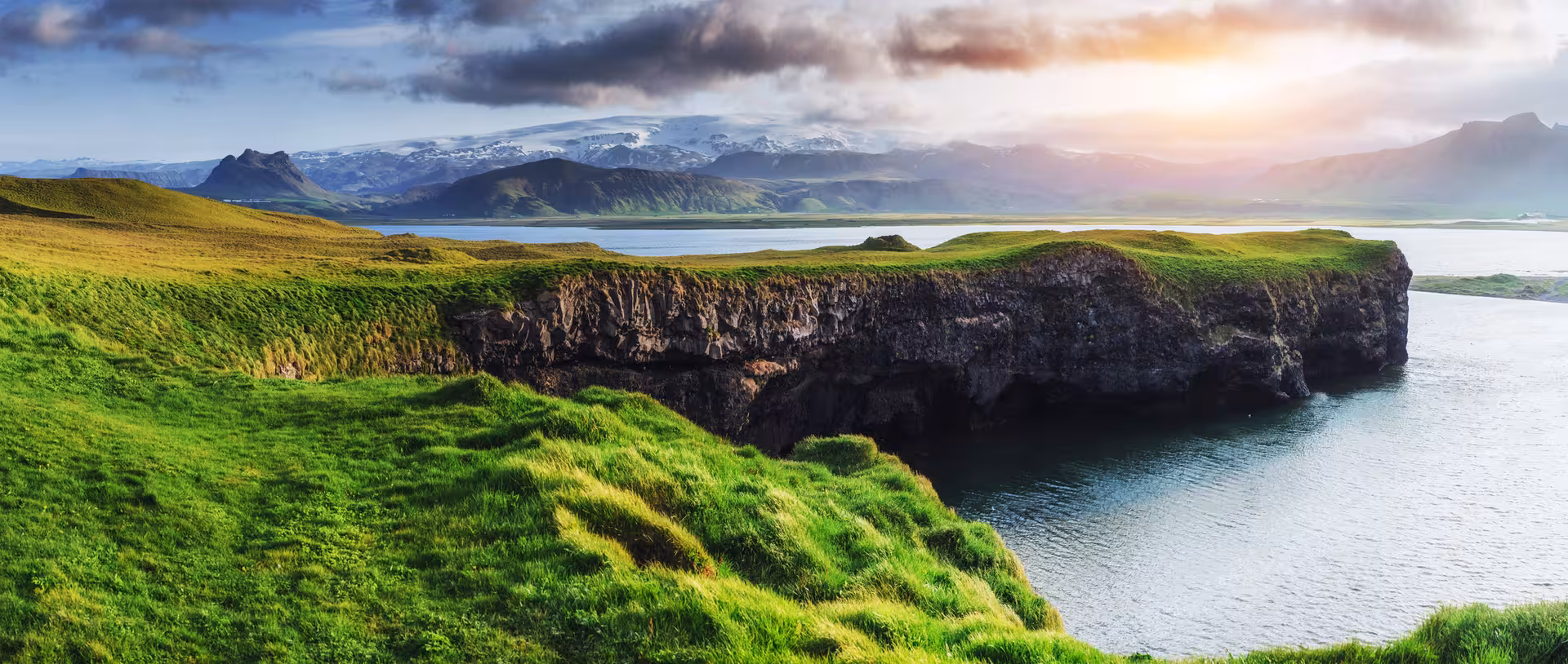 Scenic South Shore cliffs overlooking serene waters at sunset, a highlight of the waterfall adventure tour.