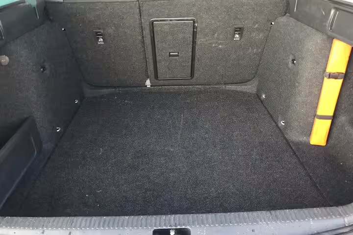 Clean empty car boot interior with dark carpet lining for Blue Lagoon airport transfer