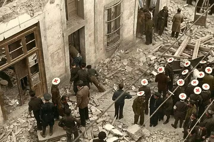 Historical scene of Spanish Civil War with Red Cross medics aiding in a bombed street, showcasing wartime devastation.