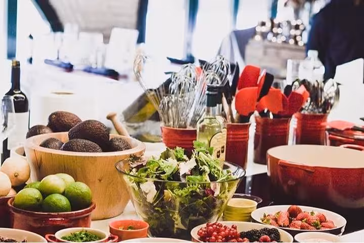 Fresh ingredients and kitchen tools ready for a Spanish cooking class in a stylish designer loft.