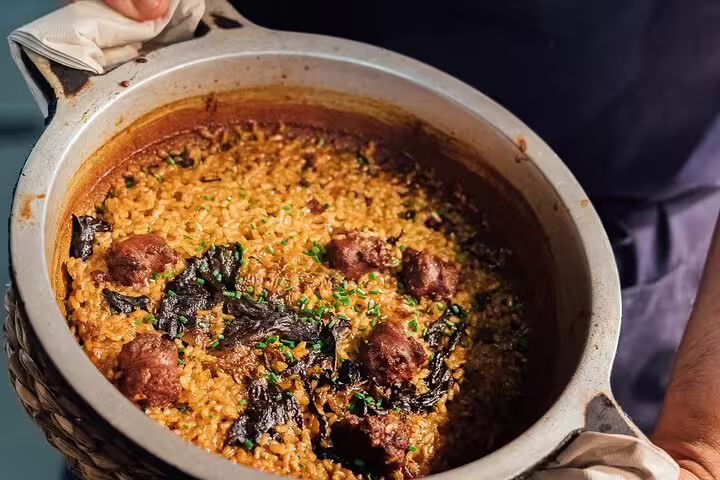 Authentic Spanish rice dish with rich spices and tender meatballs, perfect for a cultural tapas experience.