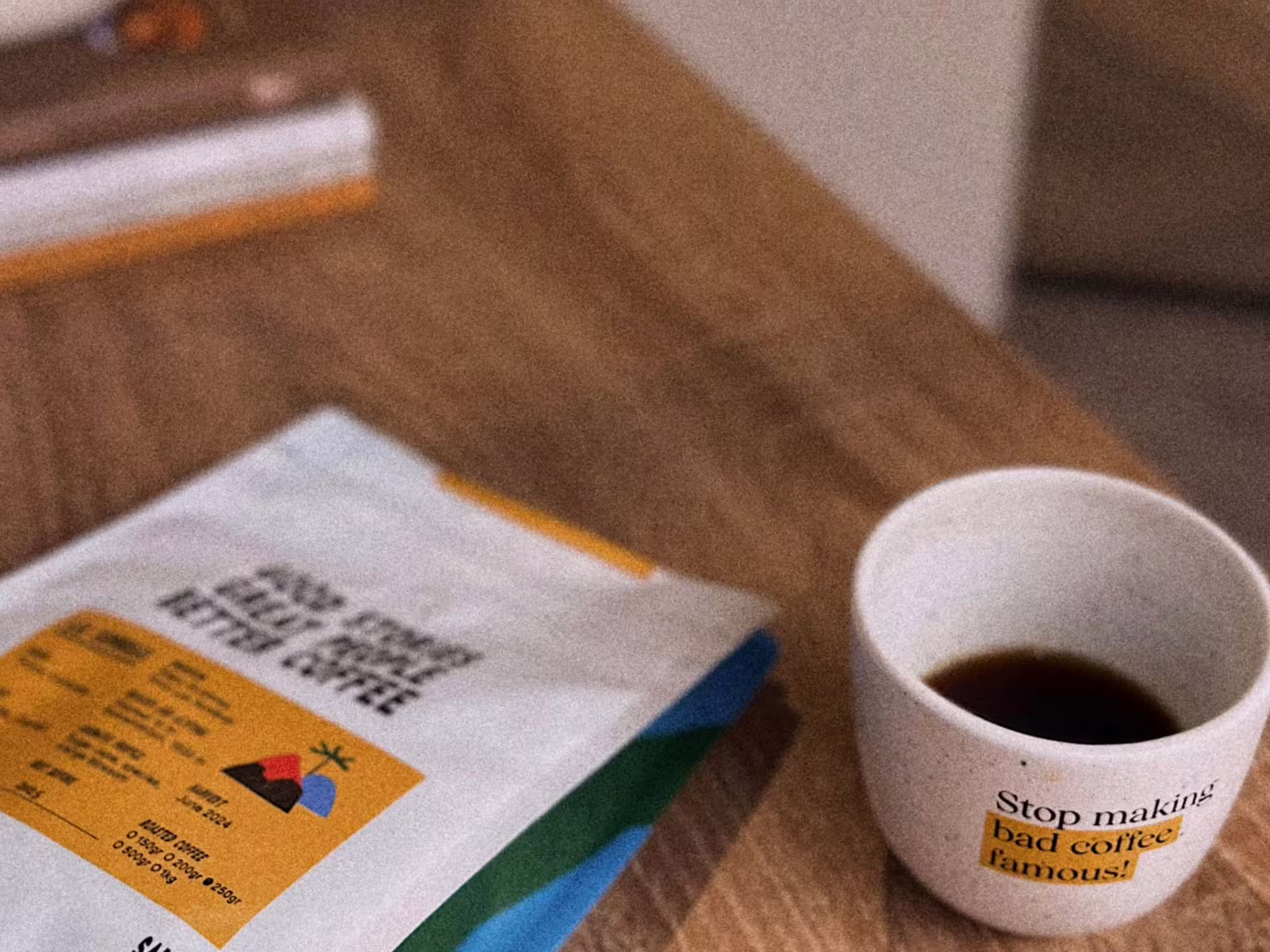 A freshly brewed coffee cup beside a specialty coffee bag during a Turin tasting experience.