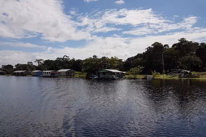 Amazon River village scenery on speed boat route from Santa Rosa Brazil Peru border to Iquitos Peru