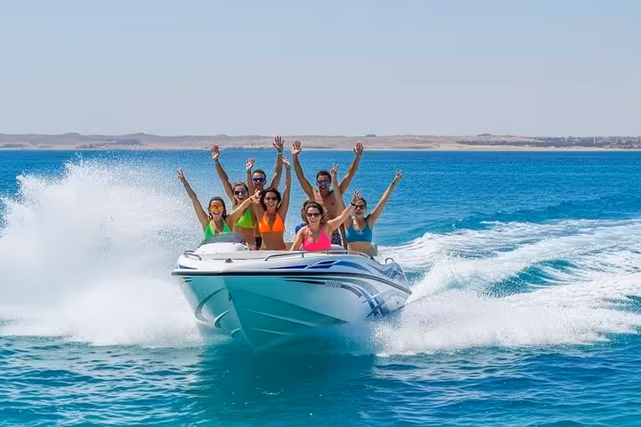 Group enjoying a 2-hour speed boat trip in Sharm El Sheikh on the Red Sea, cruising fast with big waves and smiles