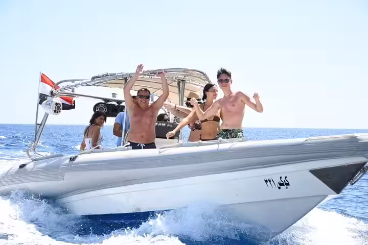 Friends enjoying a 2-hour speed boat tour in Sharm El Sheikh, cruising fast on the Red Sea waves