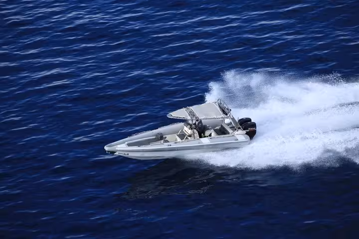 Speed boat racing across the Red Sea in Sharm El Sheikh, perfect for a 2-hour speedboat tour adventure
