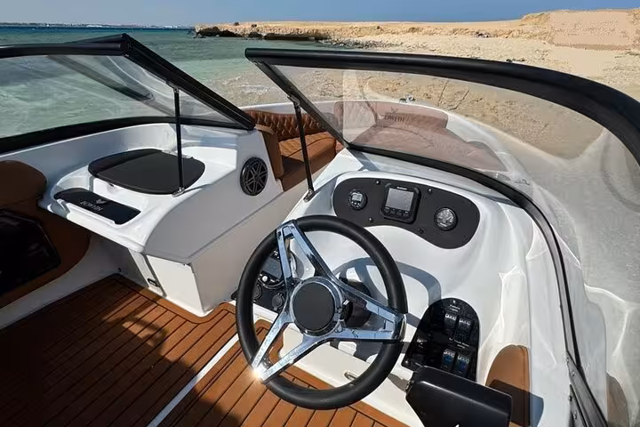 Steering console of private speedboat for Magawish Island snorkeling excursion from Hurghada, Red Sea