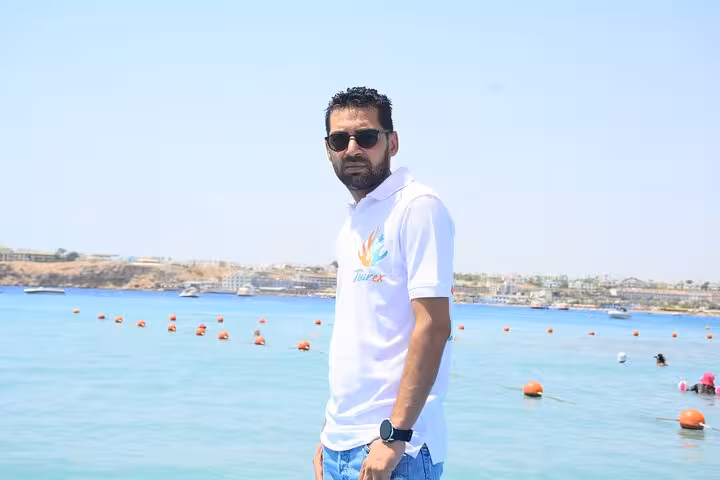 Tour staff by the Red Sea marina in Sharm El Sheikh, meeting point for 2-hour speed boat trip