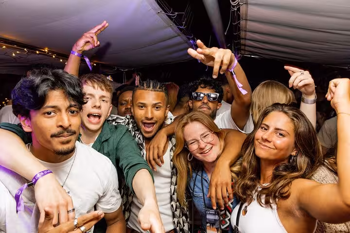 Group of friends enjoying a lively night out on the Split After Dark boat party, showcasing fun and excitement.
