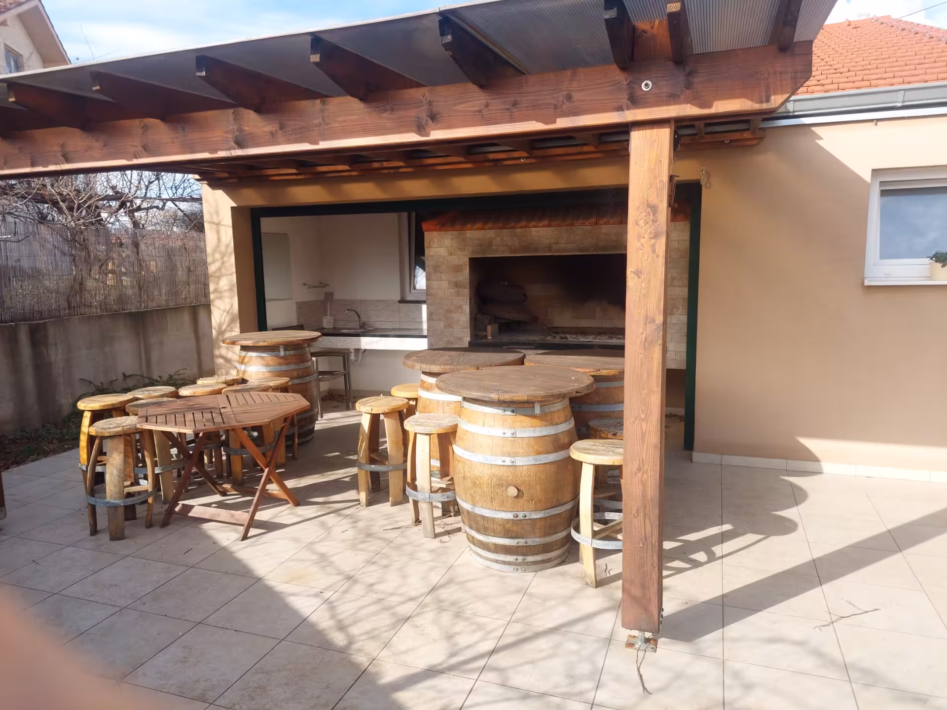 Outdoor winery terrace with barrel tables near Split, ideal stop on Imotski Lakes wine and dine tour