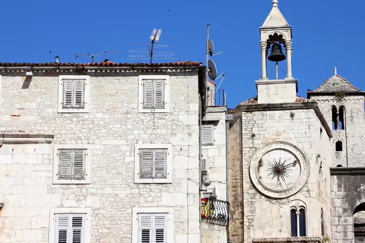 Historic stone buildings and church bell tower in Split Old Town, ideal stop on a self-guided scavenger hunt tour