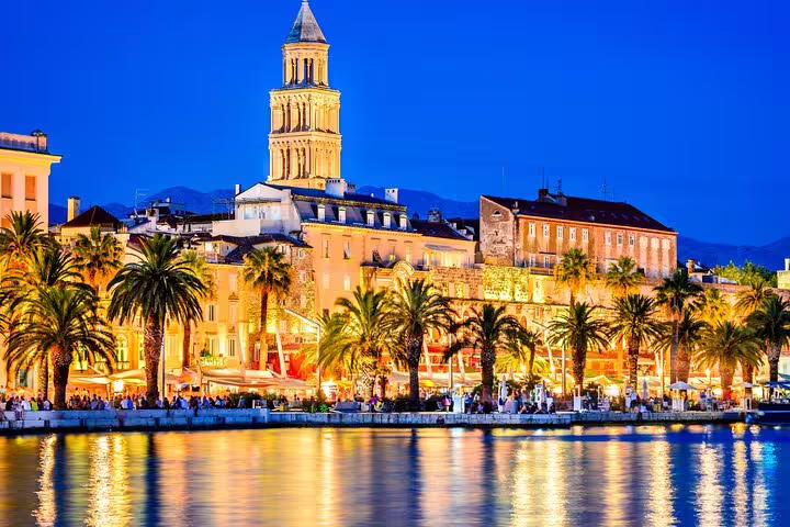 Split Riva waterfront at dusk with palm trees and Diocletian-era bell tower, ideal for self-guided scavenger hunt