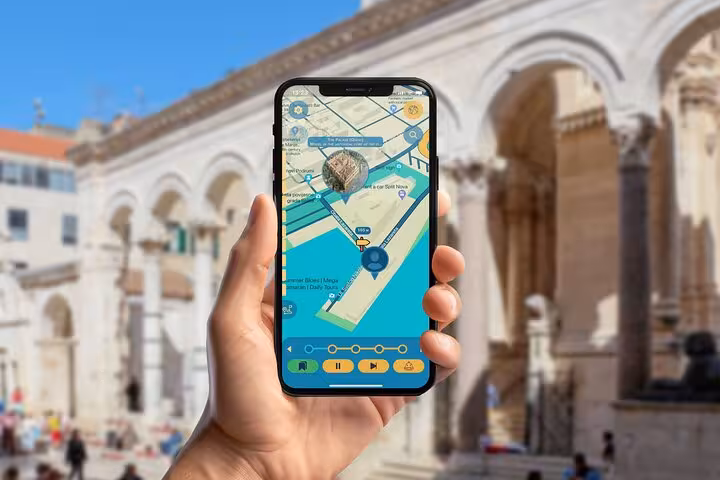 Smartphone showing self-guided walking tour app navigation near Diocletian's Palace in Split Croatia