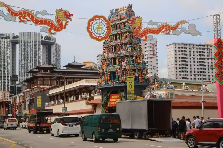 Discover Sri Mariamman Temple in Singapore's Chinatown, a colorful Hindu temple amidst urban surroundings.