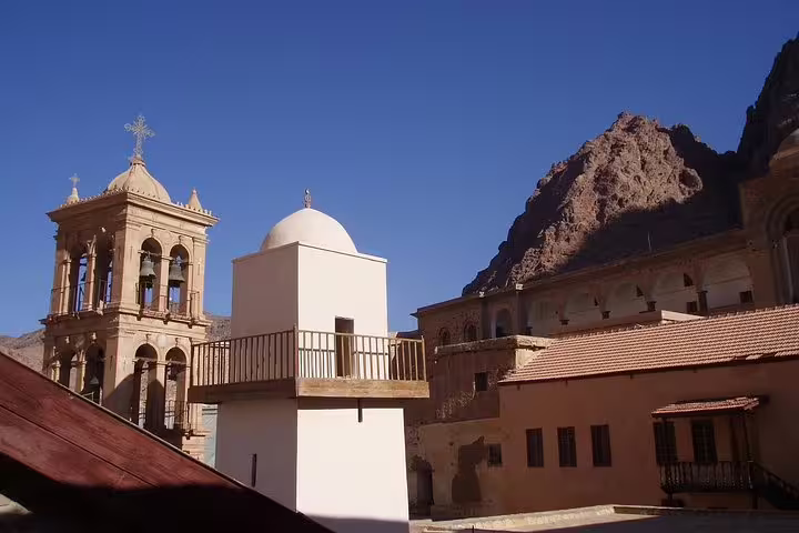 St Catherine Monastery bell tower and courtyard buildings under Mount Sinai on private day tour from Sharm El Sheikh