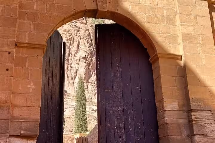 Stone arch doorway of St Catherine’s Monastery in Sinai, visited on Sharm El Sheikh to Dahab tour