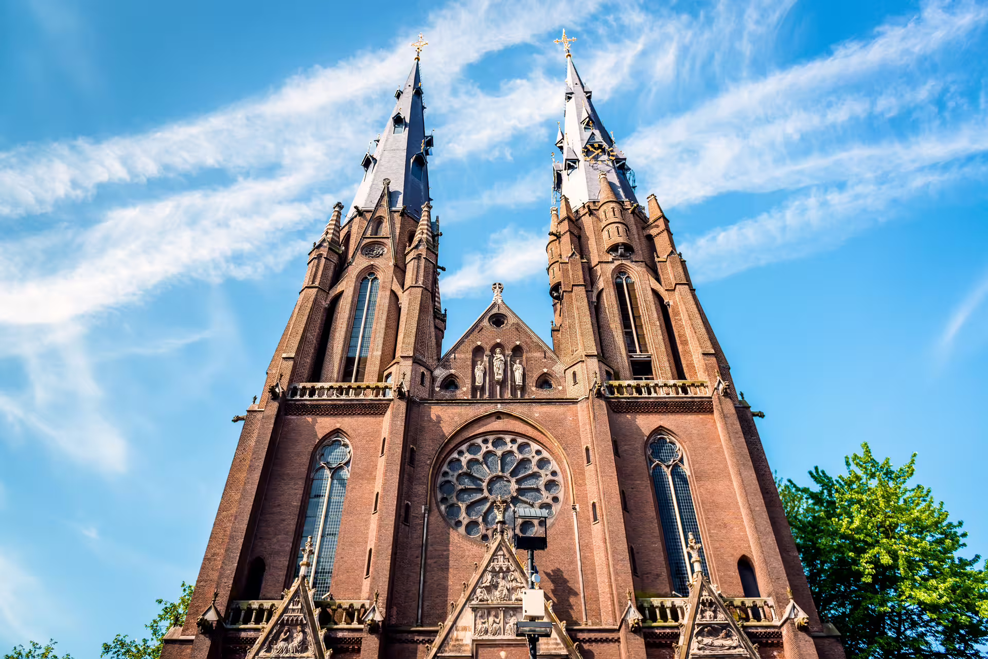 St. Catherine’s Church twin spires in Eindhoven, highlight stop on 1-day walking tour with audioguide