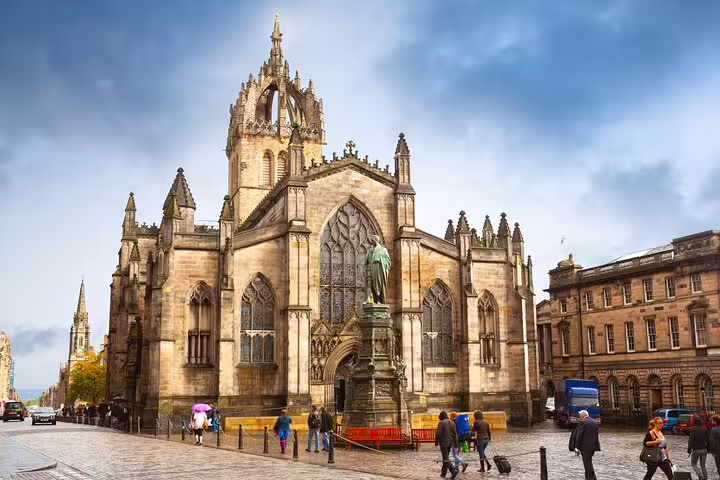 St Giles' Cathedral on the Royal Mile in Edinburgh, a Gothic stone church under dramatic cloudy skies