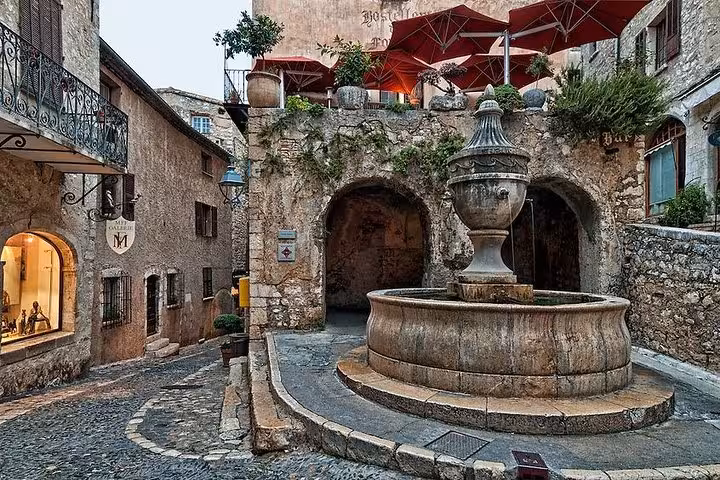 Historic stone fountain in the medieval village square of Saint-Paul de Vence, French Riviera