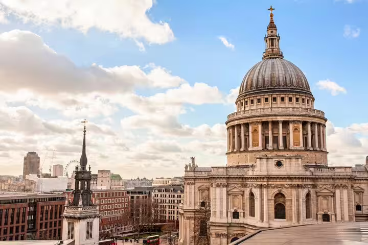 St Paul's Cathedral dome and London skyline with the London Eye visible in the background